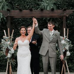 Pine cones, flowery hair, and forest chic combine at this rustic wedding