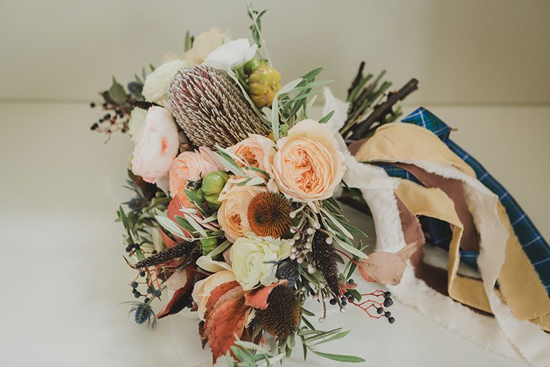 An Autumn witch lesbian wedding with tarot, tattoos, and beer