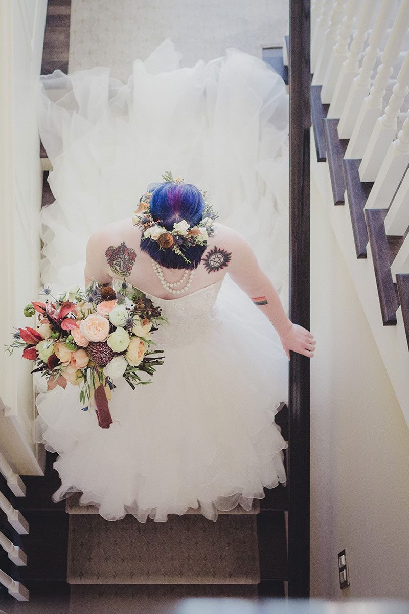 An Autumn witch lesbian wedding with tarot, tattoos, and beer