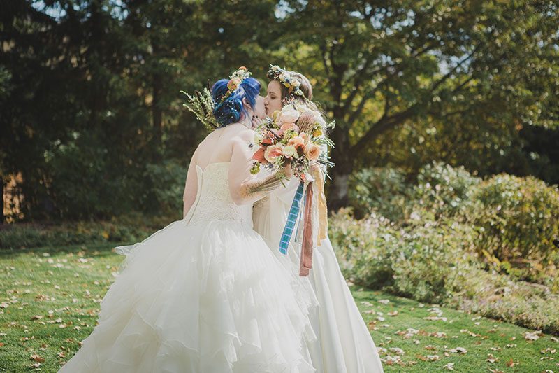 An Autumn witch lesbian wedding with tarot, tattoos, and beer