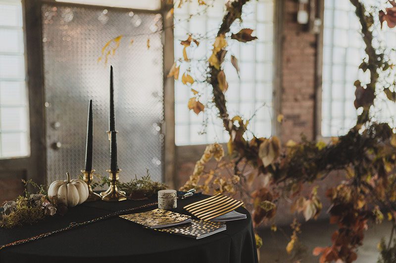 An Autumn witch lesbian wedding with tarot, tattoos, and beer