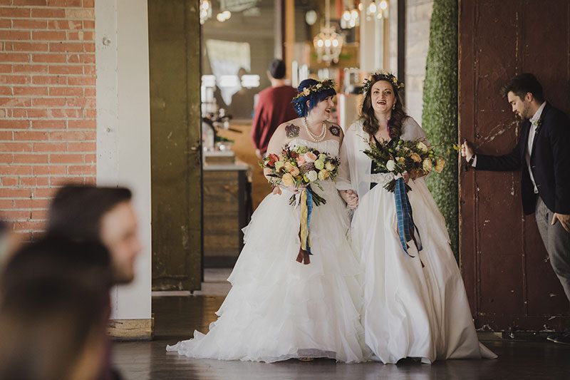 An Autumn witch lesbian wedding with tarot, tattoos, and beer