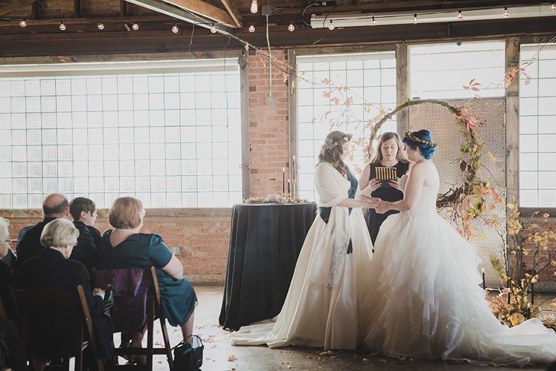 An Autumn witch lesbian wedding with tarot, tattoos, and beer