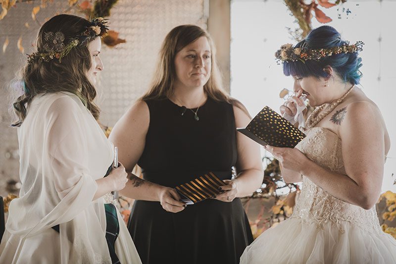 An Autumn witch lesbian wedding with tarot, tattoos, and beer