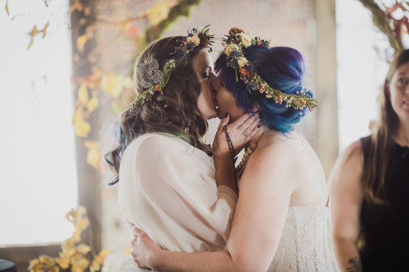 An Autumn witch lesbian wedding with tarot, tattoos, and beer