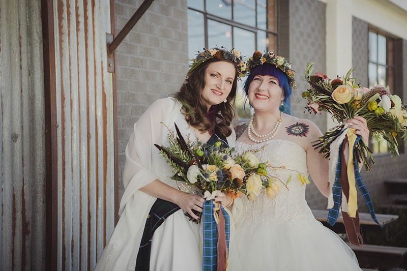 An Autumn witch lesbian wedding with tarot, tattoos, and beer