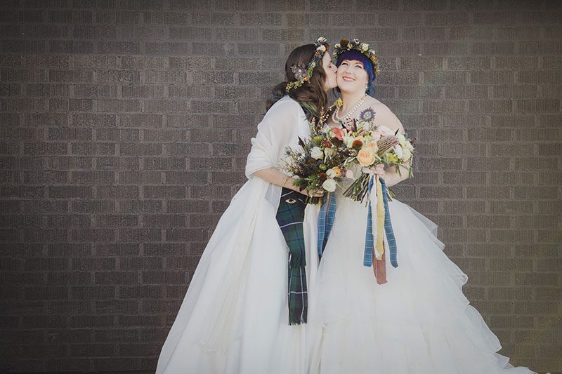 An Autumn witch lesbian wedding with tarot, tattoos, and beer