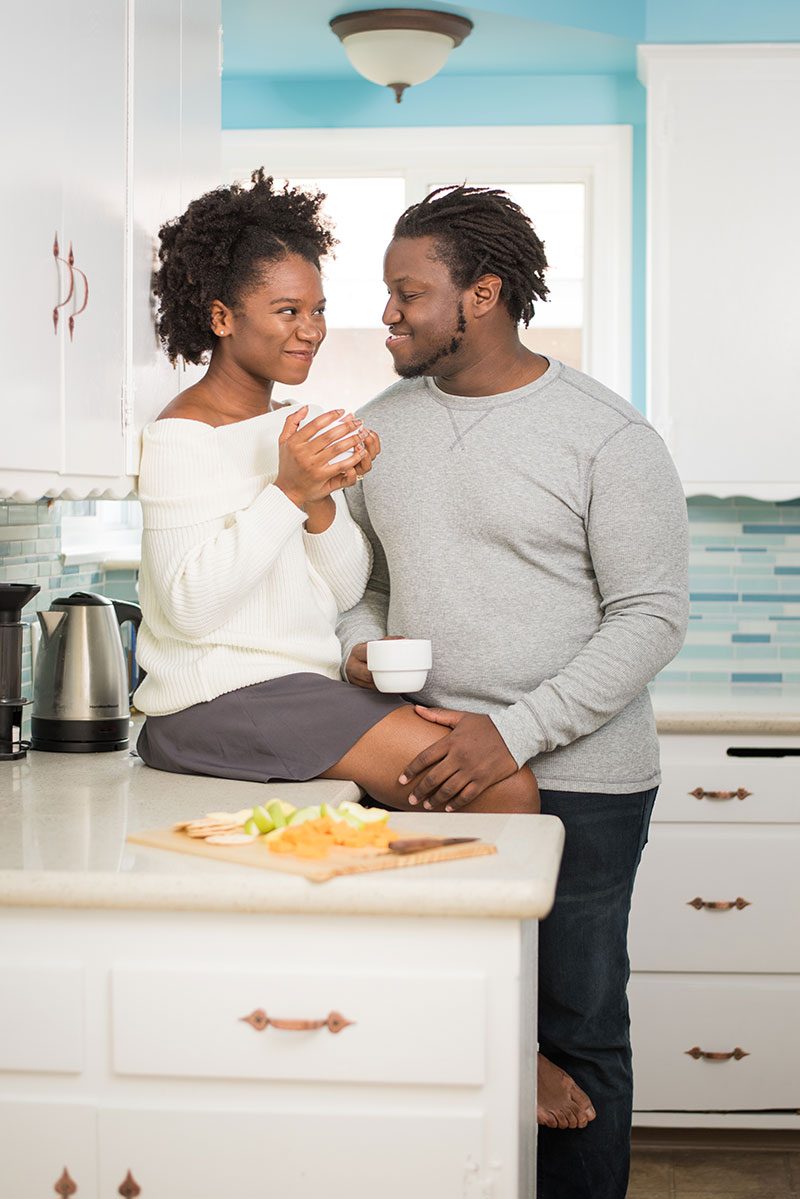 When outdoorsy isn't you: at-home engagement photos with books, vinyl, and natural black hair