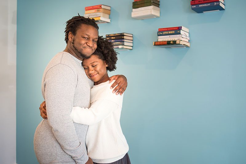 When outdoorsy isn't you: at-home engagement photos with books, vinyl, and natural black hair