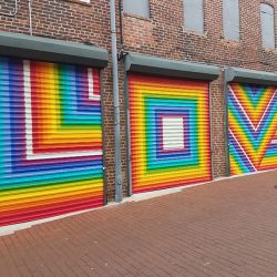 This rad pop-up wedding had glitter, sequins, and huge rainbow mural LOVE