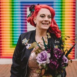 This rad pop-up wedding had glitter, sequins, and huge rainbow mural LOVE