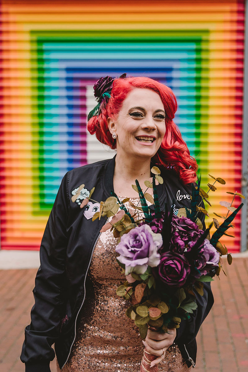 This rad pop-up wedding had glitter, sequins, and huge rainbow mural LOVE