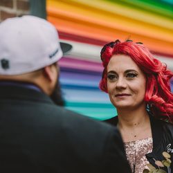 This rad pop-up wedding had glitter, sequins, and huge rainbow mural LOVE