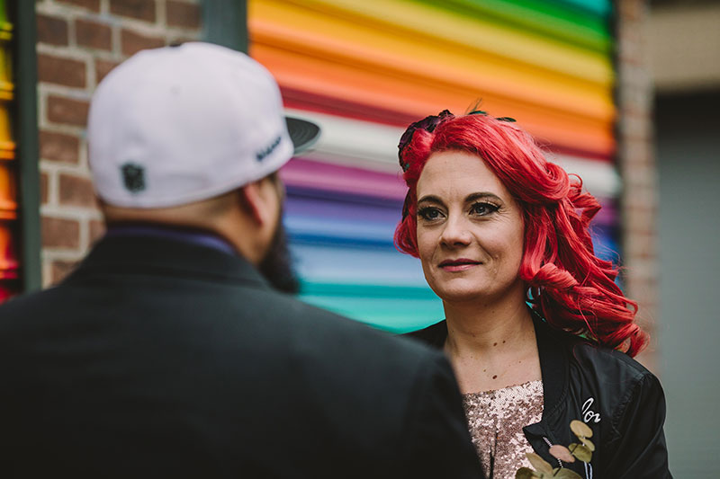 This rad pop-up wedding had glitter, sequins, and huge rainbow mural LOVE