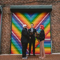 This rad pop-up wedding had glitter, sequins, and huge rainbow mural LOVE