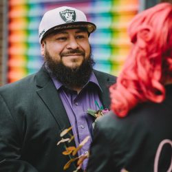 This rad pop-up wedding had glitter, sequins, and huge rainbow mural LOVE