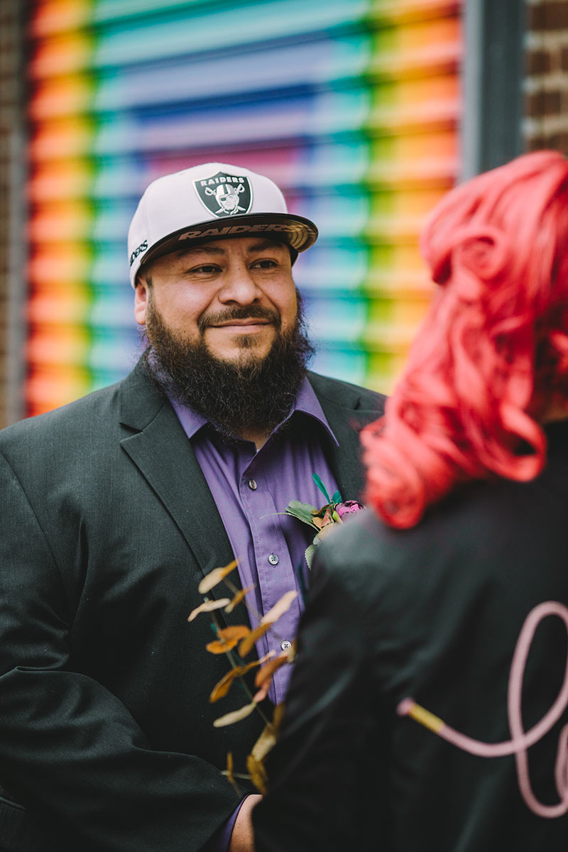 This rad pop-up wedding had glitter, sequins, and huge rainbow mural LOVE