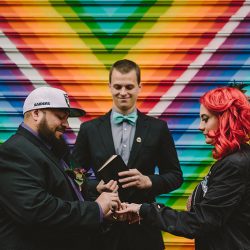This rad pop-up wedding had glitter, sequins, and huge rainbow mural LOVE