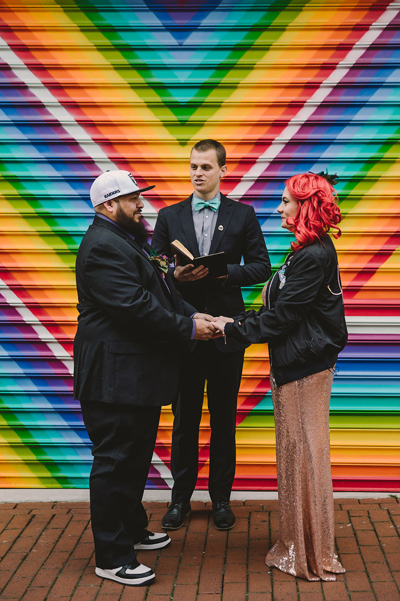 This rad pop-up wedding had glitter, sequins, and huge rainbow mural LOVE