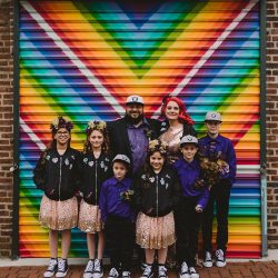 This rad pop-up wedding had glitter, sequins, and huge rainbow mural LOVE