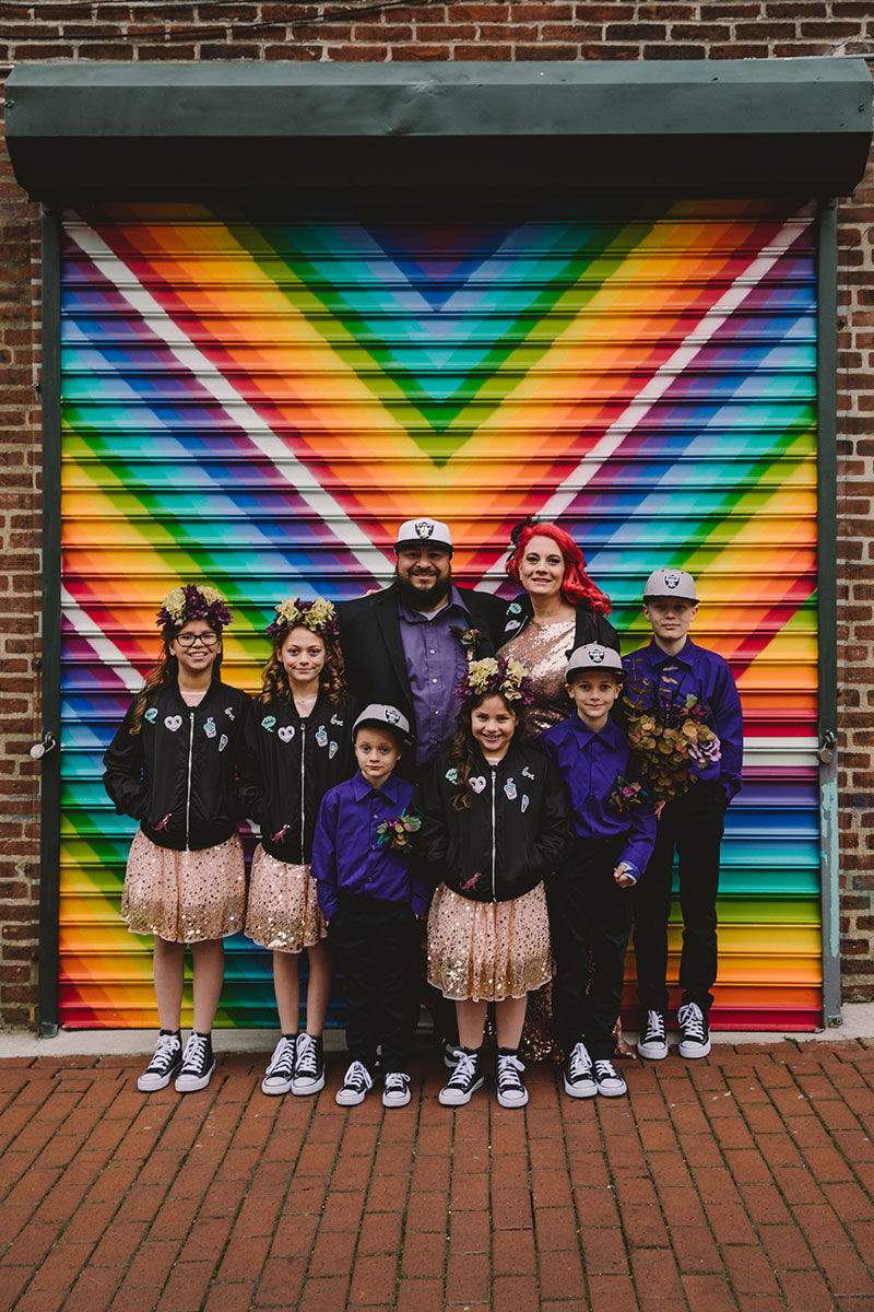 This rad pop-up wedding had glitter, sequins, and huge rainbow mural LOVE