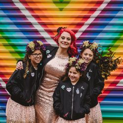 This rad pop-up wedding had glitter, sequins, and huge rainbow mural LOVE