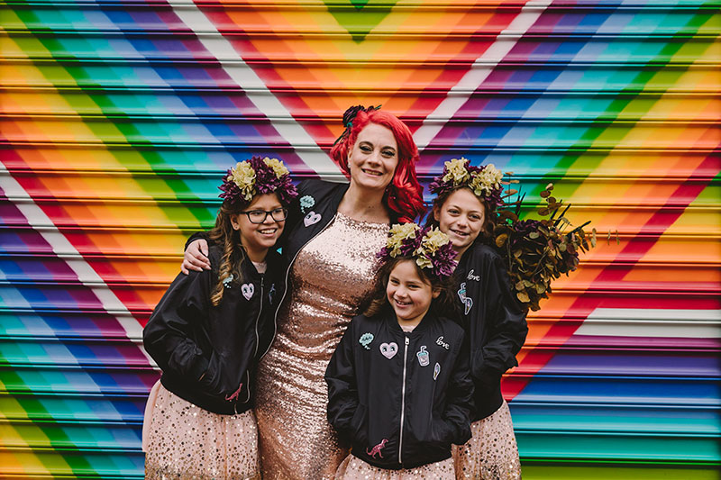 This rad pop-up wedding had glitter, sequins, and huge rainbow mural LOVE
