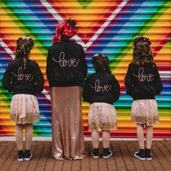 This rad pop-up wedding had glitter, sequins, and huge rainbow mural LOVE