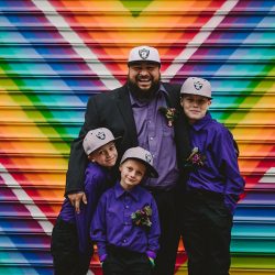 This rad pop-up wedding had glitter, sequins, and huge rainbow mural LOVE