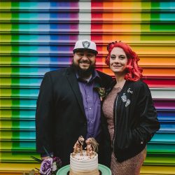 This rad pop-up wedding had glitter, sequins, and huge rainbow mural LOVE