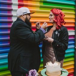 This rad pop-up wedding had glitter, sequins, and huge rainbow mural LOVE