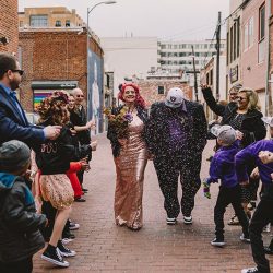 This rad pop-up wedding had glitter, sequins, and huge rainbow mural LOVE
