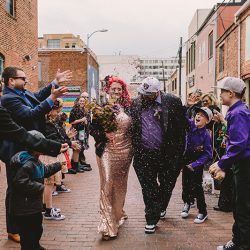 This rad pop-up wedding had glitter, sequins, and huge rainbow mural LOVE