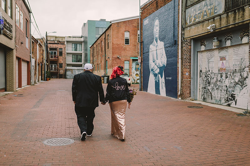 This rad pop-up wedding had glitter, sequins, and huge rainbow mural LOVE