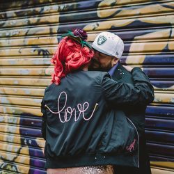 This rad pop-up wedding had glitter, sequins, and huge rainbow mural LOVE