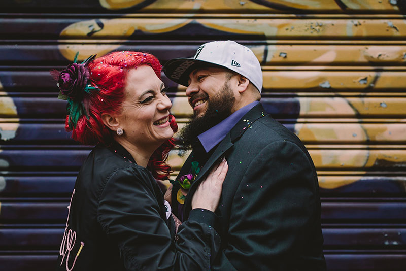 This rad pop-up wedding had glitter, sequins, and huge rainbow mural LOVE