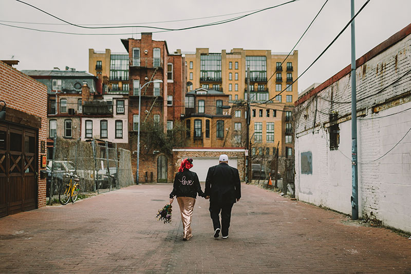 This rad pop-up wedding had glitter, sequins, and huge rainbow mural LOVE