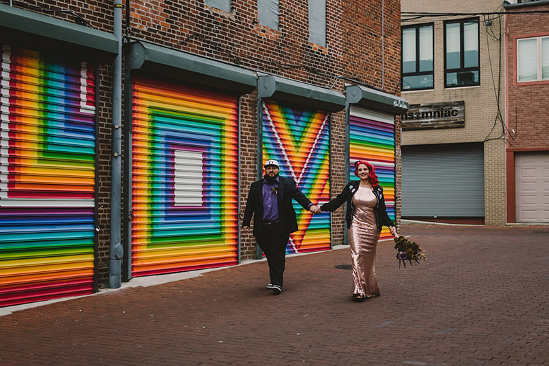 This rad pop-up wedding had glitter, sequins, and huge rainbow mural LOVE