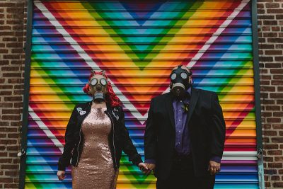 This rad pop-up wedding had glitter, sequins, and huge rainbow mural LOVE