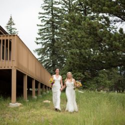 Two brides, a mountain view wedding, and cotton candy skies