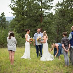 Two brides, a mountain view wedding, and cotton candy skies