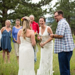 Two brides, a mountain view wedding, and cotton candy skies