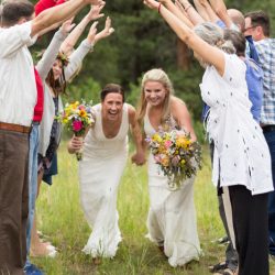 Two brides, a mountain view wedding, and cotton candy skies