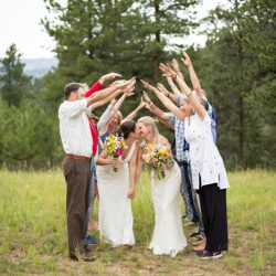 Two brides, a mountainside wedding, and cotton candy skies