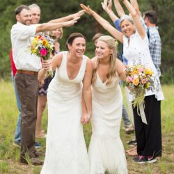 Two brides, a mountainside wedding, and cotton candy skies