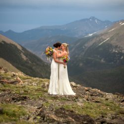 Two brides, a mountainside wedding, and cotton candy skies