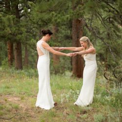 Two brides, a mountain view wedding, and cotton candy skies