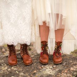 Two brides, a mountainside wedding, and cotton candy skies