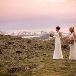 Two brides, a mountainside wedding, and cotton candy skies
