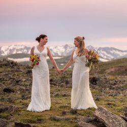 Two brides, a mountainside wedding, and cotton candy skies